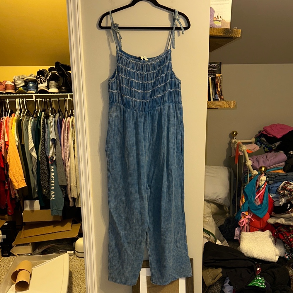 Davi & Dani size large blue jumpsuit with smocked top and pockets and tie straps